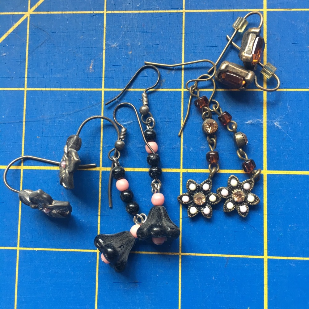 4 pairs of earrings mostly floral